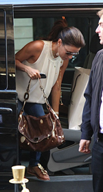 Eva Longoria is seen here with a cow skin handbag. Photo from Bag That Style.